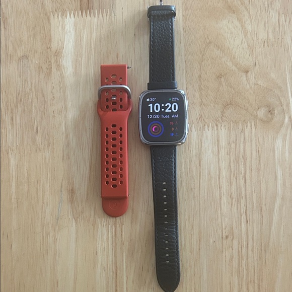 Versatile Smartwatch with Black and Orange Bands